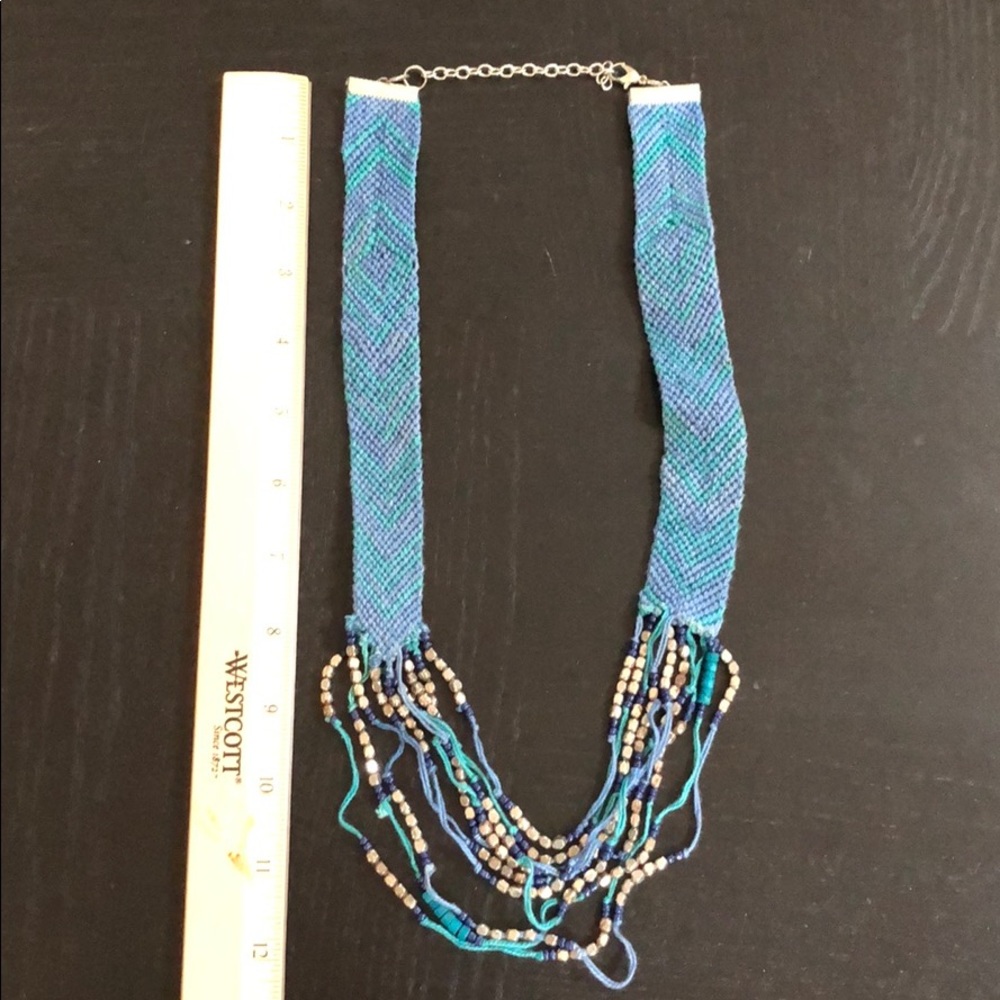 Blue/teal necklace with silver bead detailing